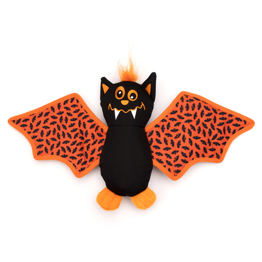 A plush bat toy with a black body, orange wings patterned with small black bats, orange feet, and orange hair on a white background.