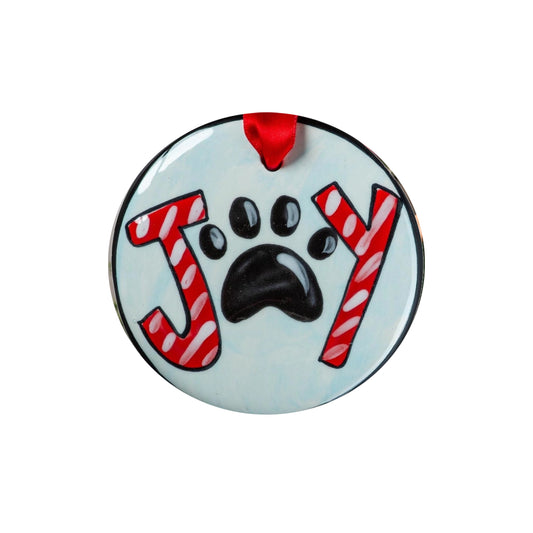 Decorative ornament with 'Joy' and a paw print design on a light blue background