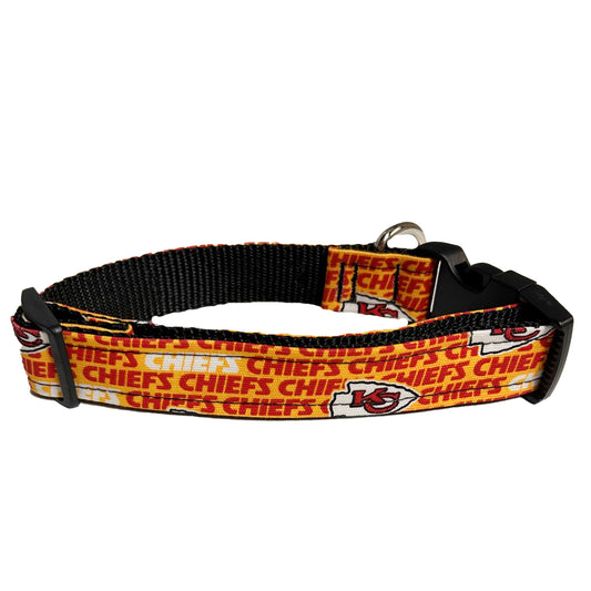 Kansas City Chiefs dog collar with yellow background and red "CHIEFS" with white and red arrowheads.  Metal D-ring attachment and plastic buckle clasp.