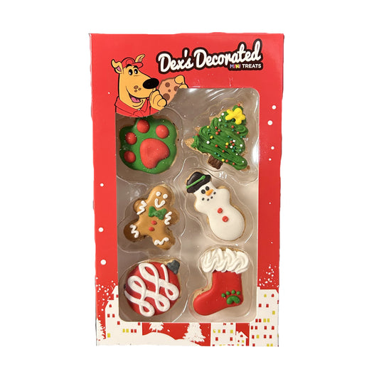 Packaged dog treats with Christmas-themed designs on a red box.