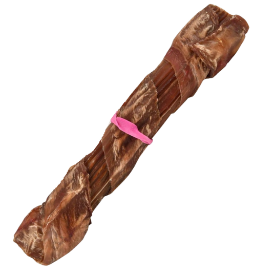 A natural brown dog chew bone, likely a bully's bone or similar cured meat bone, wrapped with a bright pink rubber band in the center, isolated on a white background.